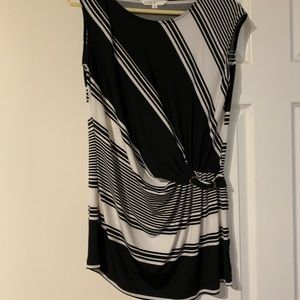 Silver buckle cinches at waist. Sleeveless black & White striped tunic in medium